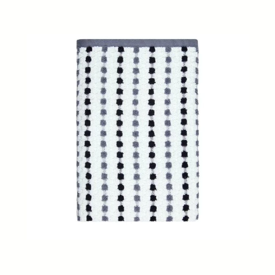 White bath towel with rows of black and grey dots