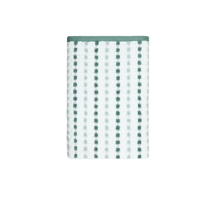 White bath towel with rows of green dots