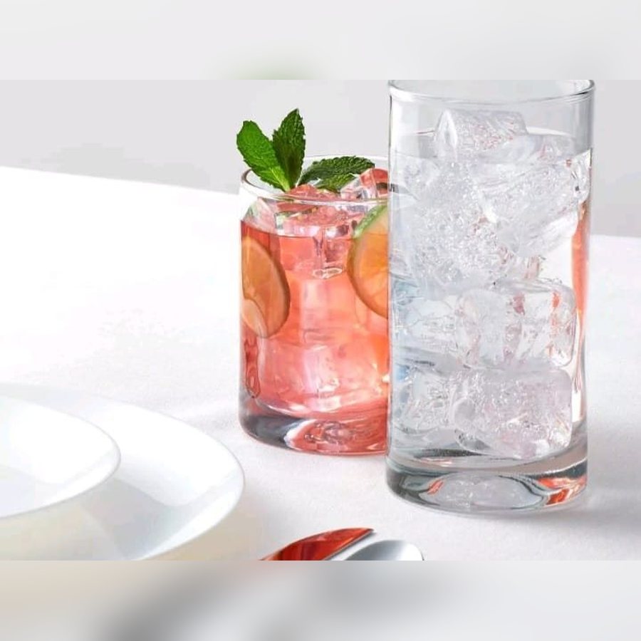 Two glass tumblers filled with drinks